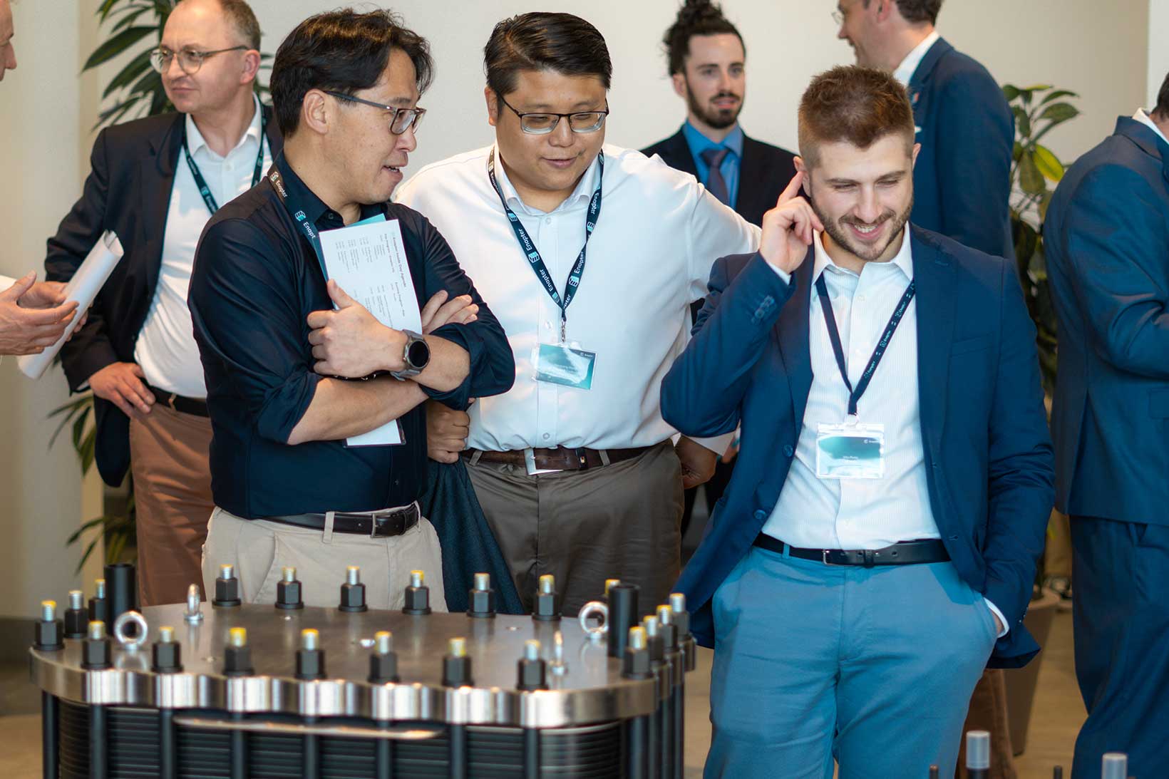 Attendees at Enapter Inside Day 2026 examining an AEM stack