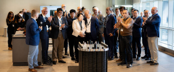Attendees and speakers at Enapter AG's presentation of the new Stack 250 hydrogen production stack for multi-megawatt applications during an industry conference.
